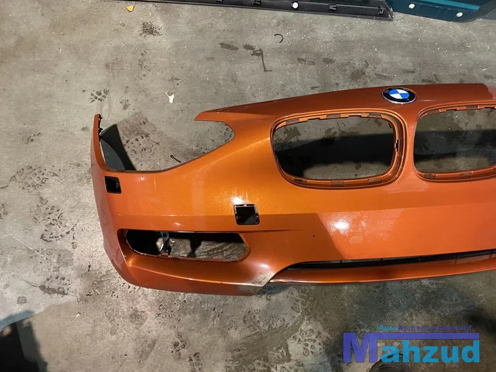 bmw-f20-f21-oranje-b44-voorbumper-koplamp-sproeiers — foto 3