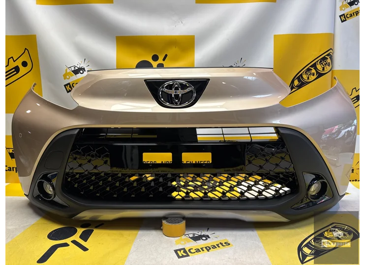 Toyota Aygo X Voorbumper origineel 52119-OH19 pdc compleet